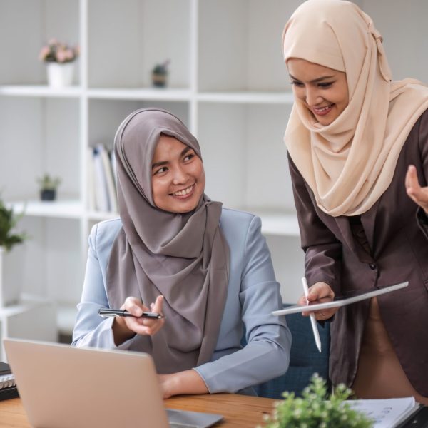 Professional Muslim business team working together, discussing on an important project in the office room. co-working concept..